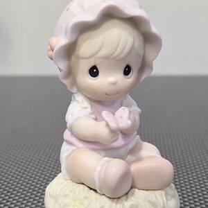 Precious Moments Pink and White Figurine